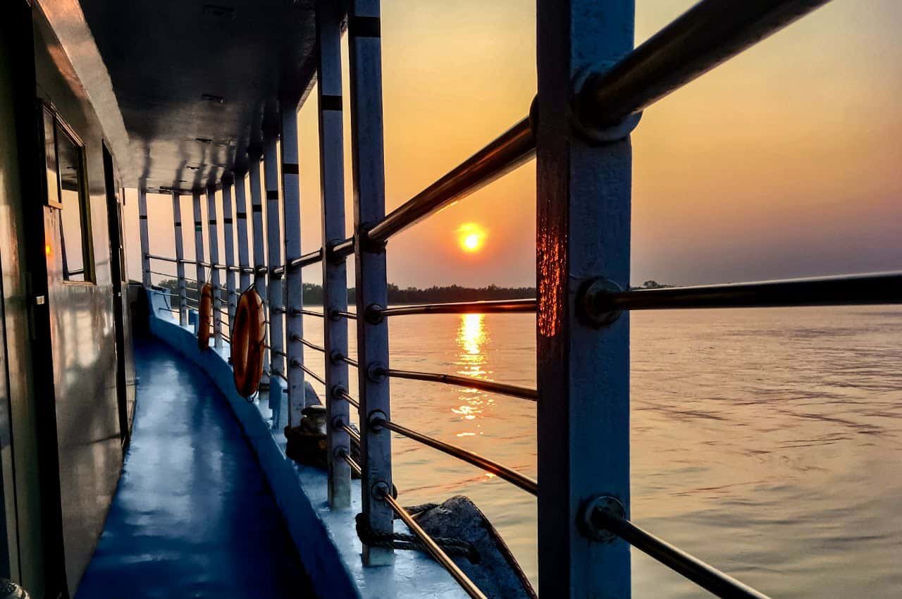 Sunset reflected on the Sundarban river beside the onboard passage of Whispering Winds