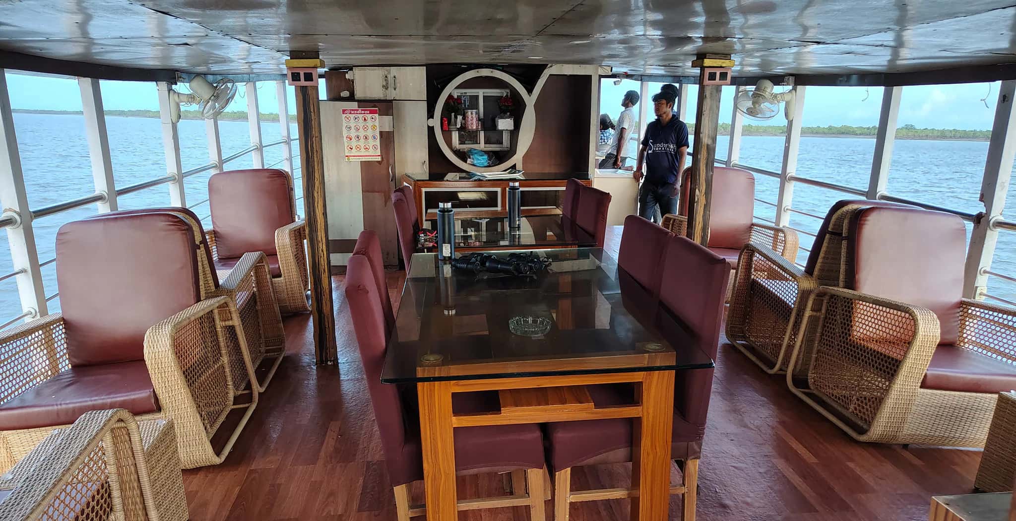 River-facing upper deck seating aboard Whispering Winds